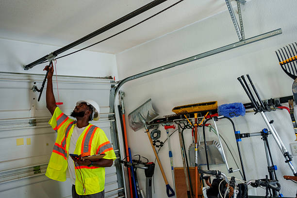 Professional Garage Door Panel Replacement technician working in Booneville, MS